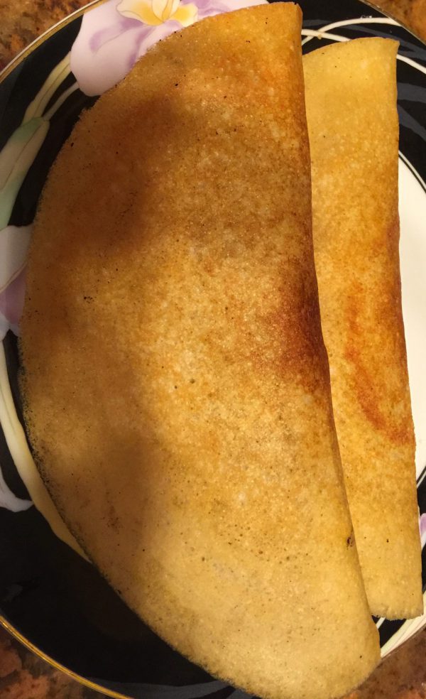 Two dosas on a plate home cooked